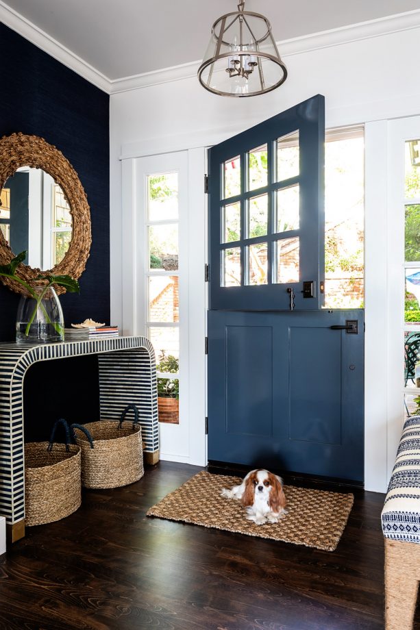 a dunn-edwards dark novelty navy blue front door that opens to beautiful sea views
