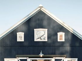a hale navy blue benjamin moore barn styled front door in a rustic farmhouse property