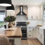 all white cabinet open space modern farmhouse kitchen and dining room combo with black appliances