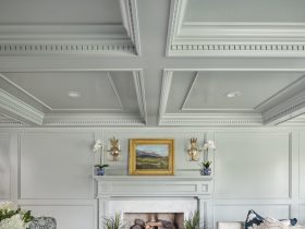 elegant formal living room with gray walls and a gold accent