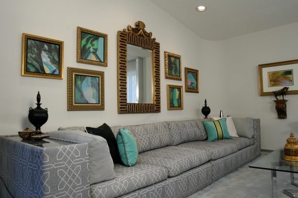 large living room with gold antique mirror frames and gray sizeable sofa