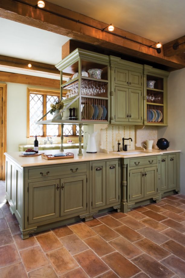 mediterranean kitchen featuring sage green beaded inset cabinets