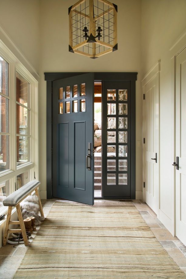mountain style entryway with a benjamin moore midnight dark blue front door