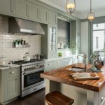 sweet victorian kitchen with sage green shaker cabinets and wood countertops