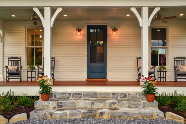 the combination of beige walls and a valspar mountain river dark blue front door