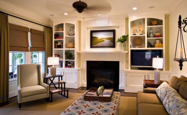 a stone standard fireplace with built-in shelves around as a media wall