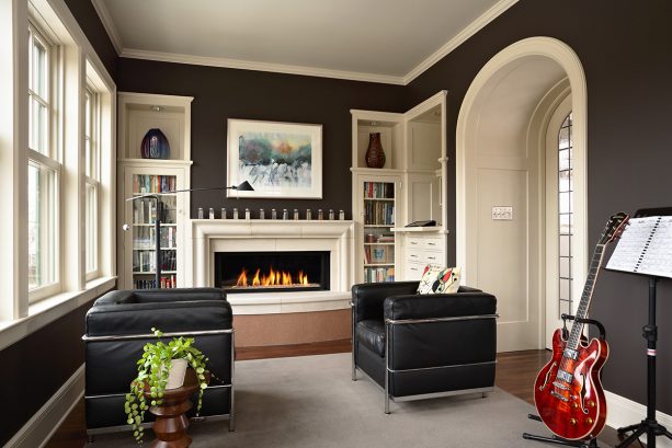 black and white stone fireplace and narrow built-in shelves