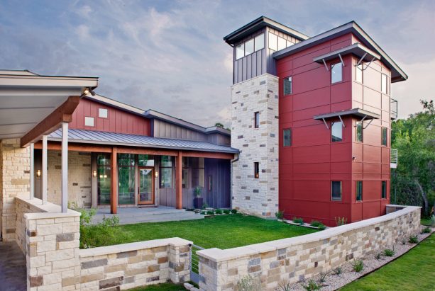 combination of cranberry red siding color and a metal roof in a modern house