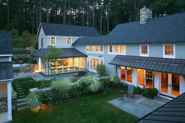 copper metal roof in a contemporary house with natural cedar color siding