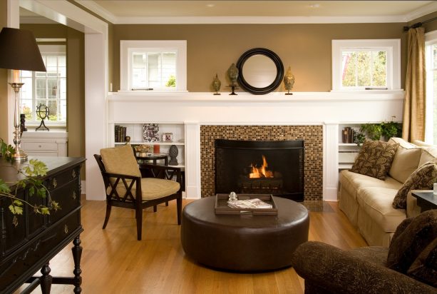 warm and traditional living room with low built-in shelves around fireplace