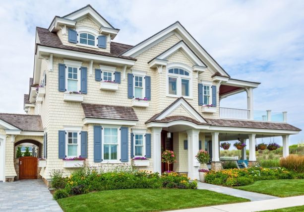 a whiter-exterior house design collaborated with blue shutters by atlantic premium