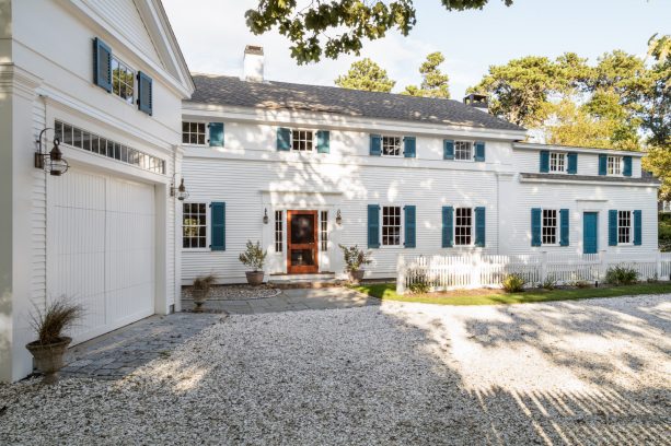 farmhouse-style in white with pigmented blue shutter