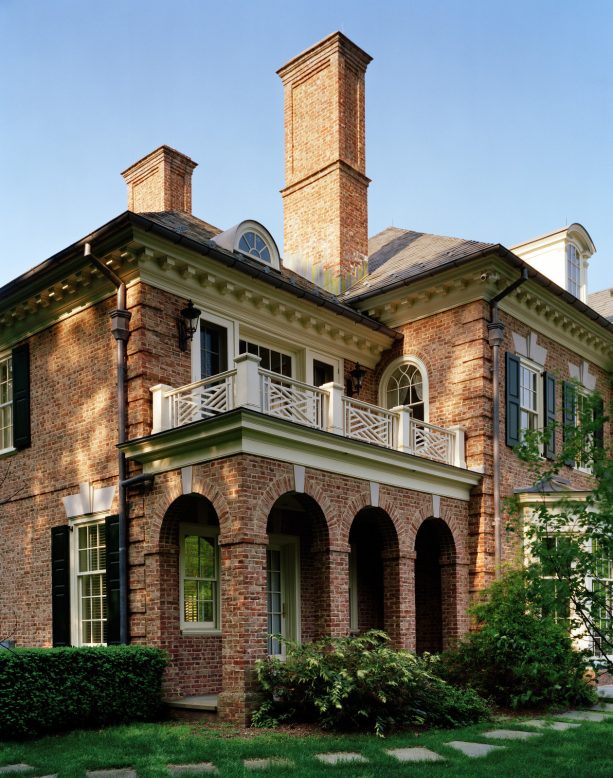 georgian house with brick exterior and leaf green shutters