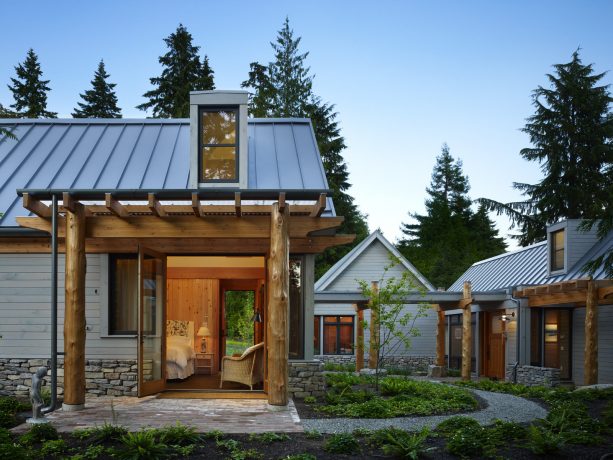 mountain style pergola attached to a gable metal roof