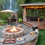 natural flagstone paver patio with seat wall and fire pit