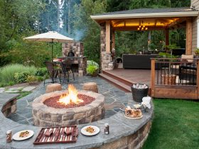 natural flagstone paver patio with seat wall and fire pit