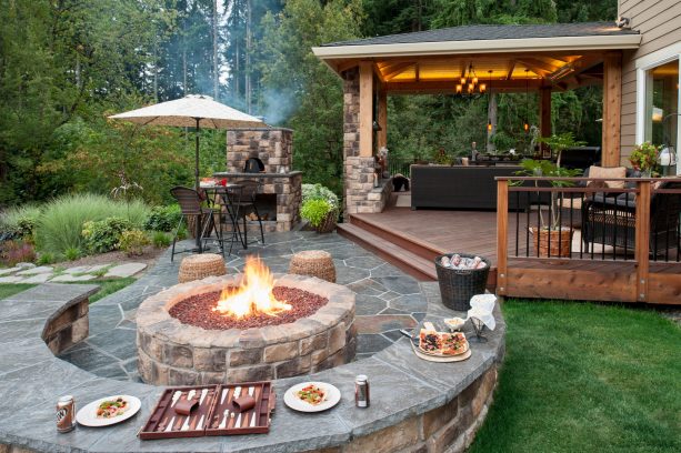 natural flagstone paver patio with seat wall and fire pit