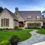 painted brick house exterior with mossy green shutters
