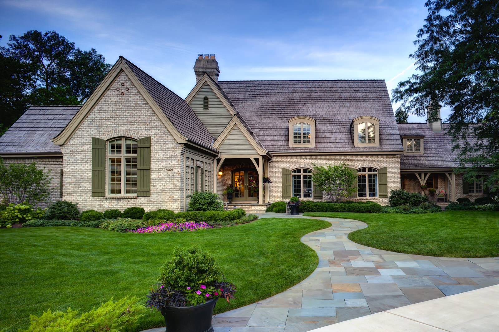 Painted Brick House Exterior With Mossy Green Shutters 