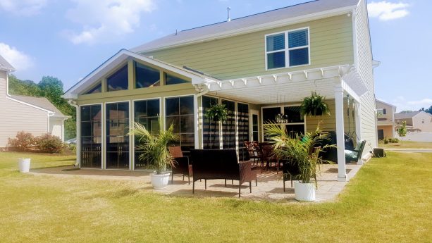 pergola attached to a roof of a craftsman screened-in back porch