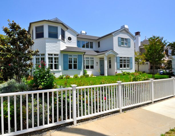 remarkable coastal-style white exterior house with sky-blue window shutters