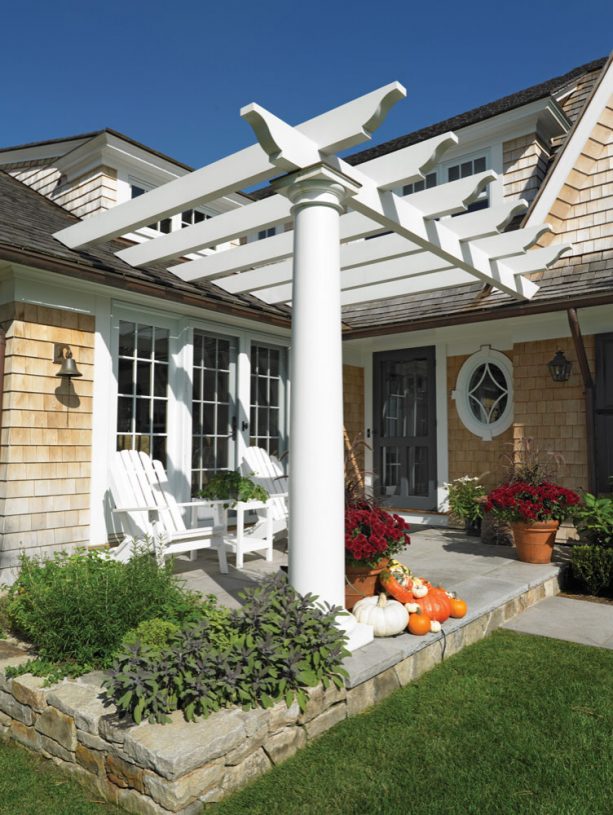 victoria style pergola attached to a roof of wood exterior home