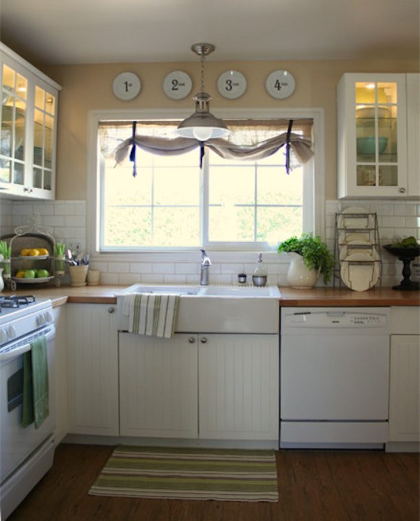 burlap curtains with grosgrain ribbon window treatment over the double-bowl kitchen sink