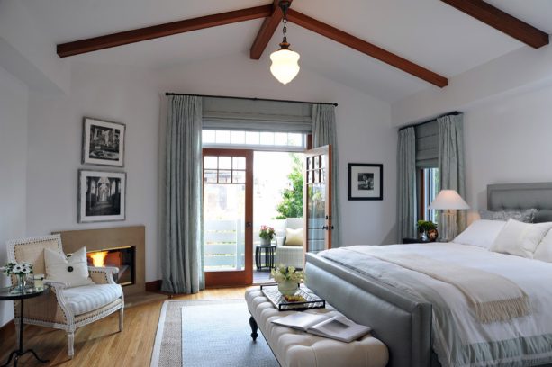 combination of curtains and roman shades for french doors in a transitional bedroom