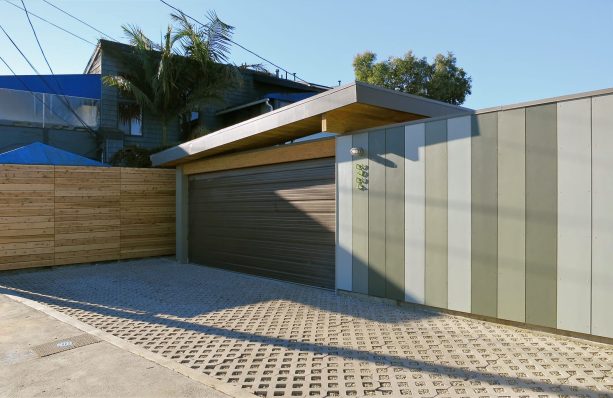 commercial ribbed sectional flat panel garage door in a minimalist style