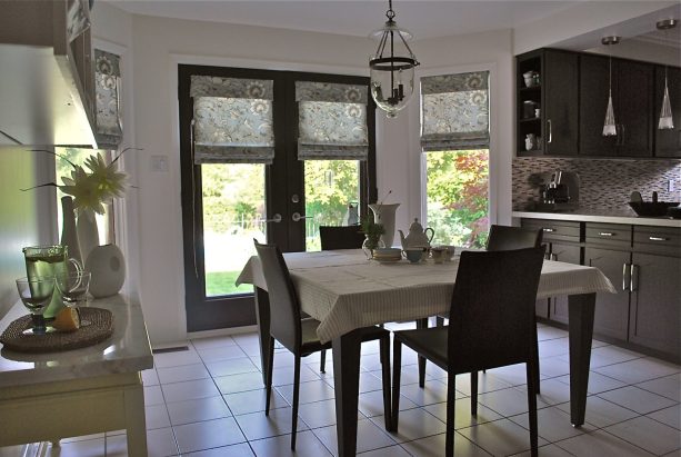 custom flat roman shades for french doors and windows in a traditional kitchen