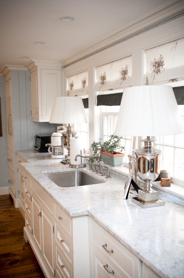 custom made flat roman shade window treatment over the kitchen sink