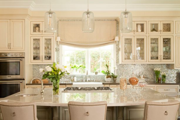 farmhouse kitchen sink with double windows and relaxed roman shade treatment