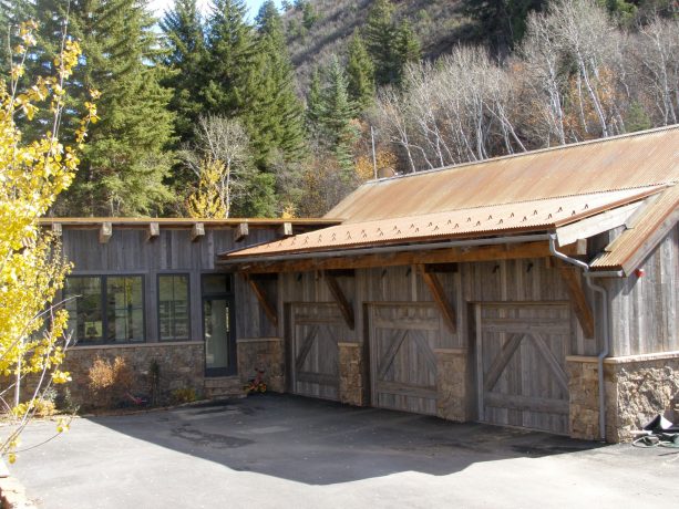four-panel garage barn doors made of distressed wood