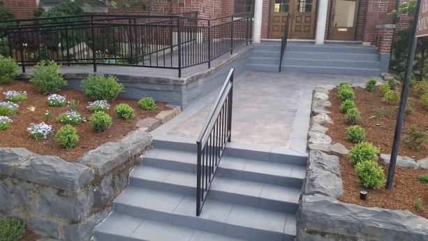 mountain style stamped concrete retaining walls with steps ramp and sidewalk