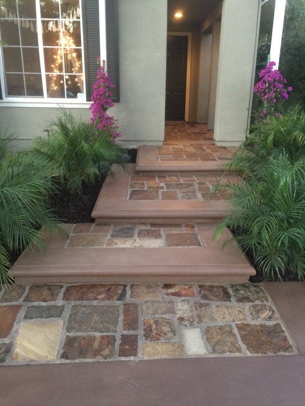 natural stone with concrete coping paver steps against a house
