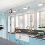 nickel finish wall mounted light over kitchen farmhouse sink