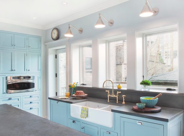 nickel finish wall mounted light over kitchen farmhouse sink