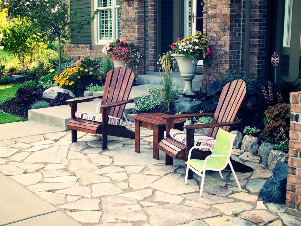 patio in the front yard in a rustic style with the stone paver