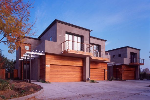 red cedar flat panel garage door that matches the siding