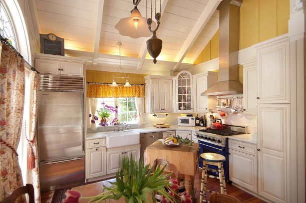 set of valance and curtain as a window treatment over the kitchen sink