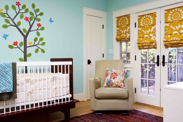 slat-front roman shade with large-pattered fabric for french doors in a nursery room