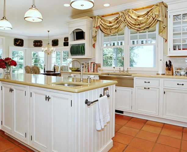 swags with two cascading jabots window treatment over a kitchen sink