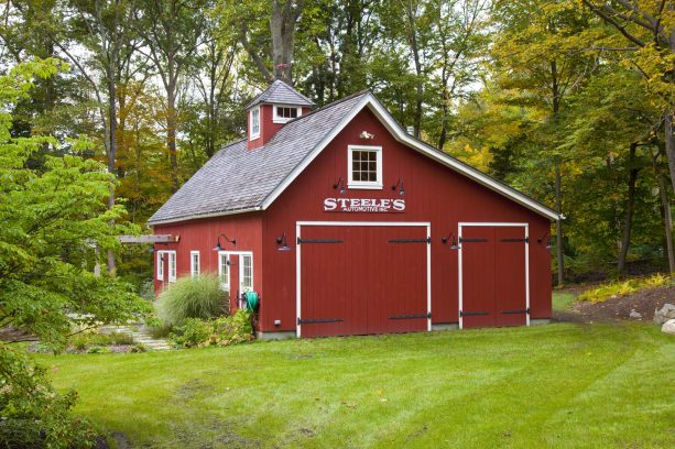 swing paneled barn garage doors in bright red color