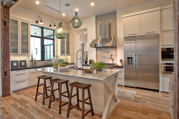 wall-mounted two-arm light over a kitchen sink