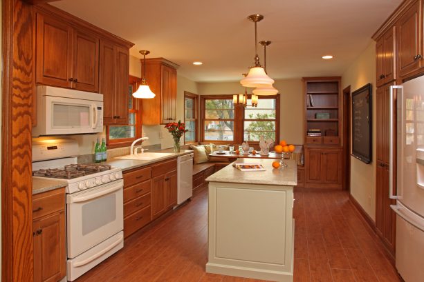 benjamin moore's sandy white goes with honey oak trim in a ranch kitchen