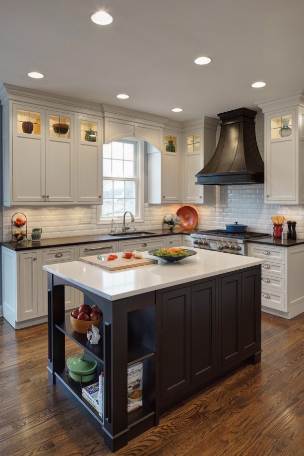 black and white island in a small l-shaped kitchen