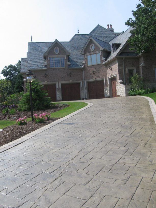 combination of stone gray color hardener and medium gray antique release stamped concrete