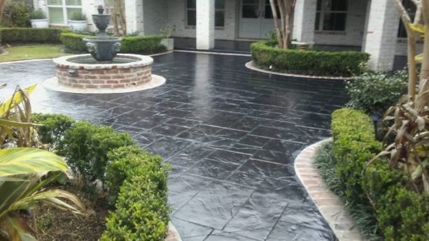 glossy black stamped concrete and natural brick border color combination