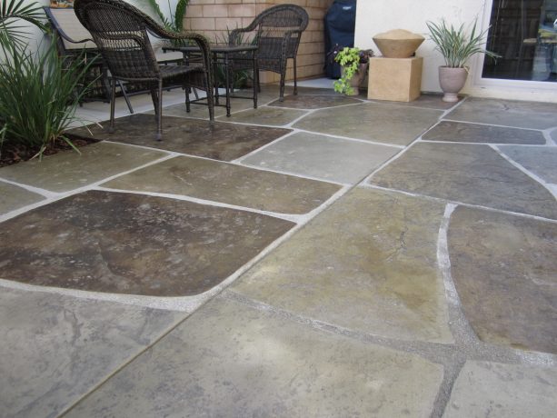 gray color stamped concrete and white grout combination to mimic natural stone