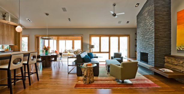 honey oak trim with soft grey wall paint color in a contemporary living room